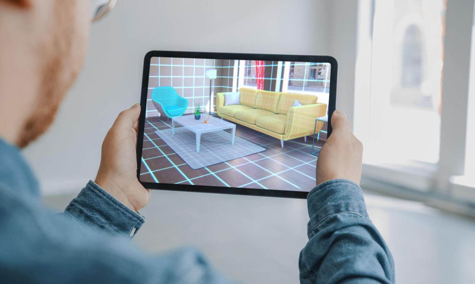 Person with a tablet and a virtual living room